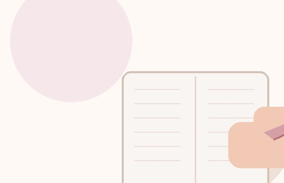 ノートに学習内容を書き込む手元